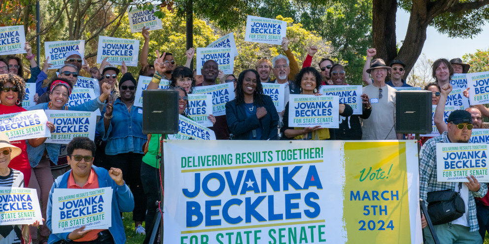 Jovanka Beckles at kick off event with a crowd of supporters behind her